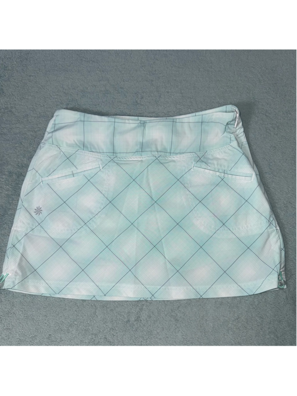 Women's Athleta Tulum Plaid Skort in a light green size 4P. Athletic sports.